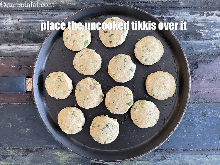 Step 30 – <meta charset="UTF-8" />Place the 12&nbsp;tikkis carefully over it.&nbsp;&nbsp;