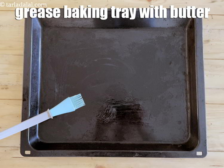 Step 21 – Grease a baking tray with butter.