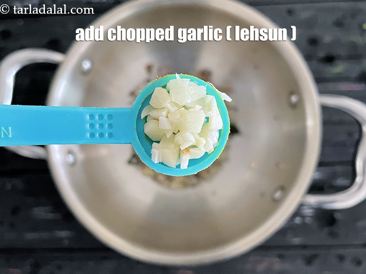 Step 22 – Add&nbsp;<meta charset="UTF-8" />1/2 tsp&nbsp;<a href="glossary-chopped-garlic-790i">chopped garlic (lehsun)</a>.
