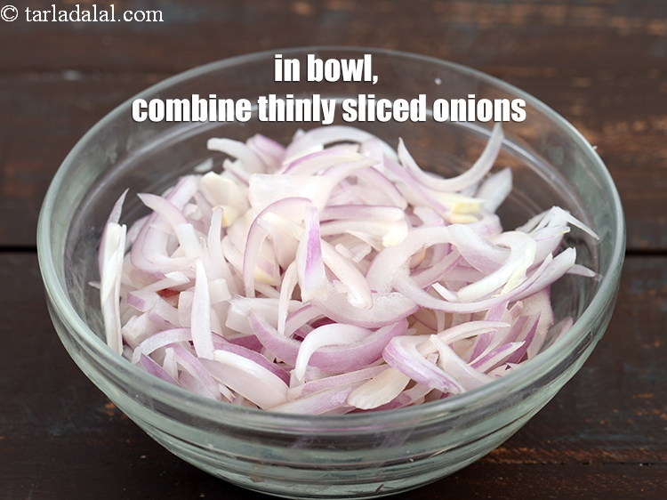 Step 23 – In a bowl, combine &frac12; cup thinly&nbsp;<a href="https://www.tarladalal.com/glossary-sliced-onions-745i">sliced onions</a>.