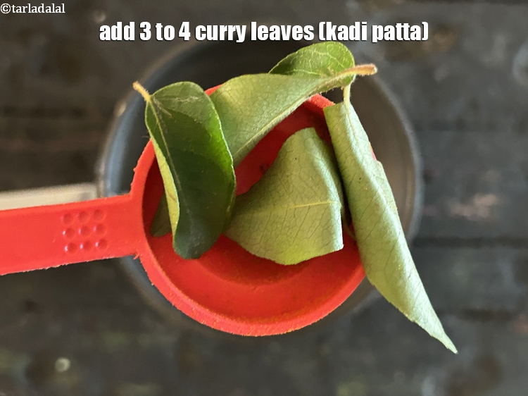 Step 25 – Add&nbsp;<meta charset="UTF-8" />3 to 4&nbsp;<a href="glossary-curry-leaves-kadi-patta-kadipatta-388i">curry leaves (kadi patta)</a>.