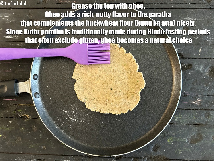 Step 23 – Grease the top with ghee. Ghee adds a rich, nutty flavor to the paratha that …