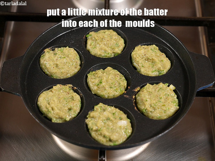 Step 25 – Put a little mixture of the batter into each of the &nbsp;moulds.