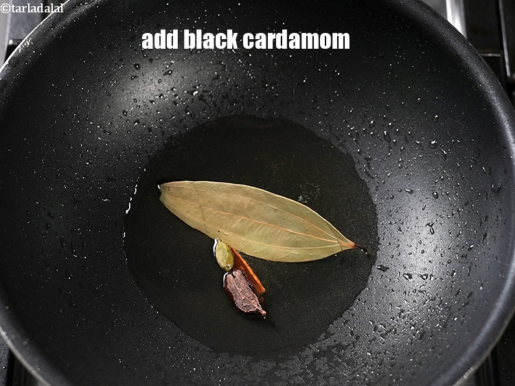 Step 23 – Add 1 <a href="https://www.tarladalal.com/glossary-black-cardamom-badi-elaichi-moti-elaichi-263i">black cardamom (badi elaichi)</a>.