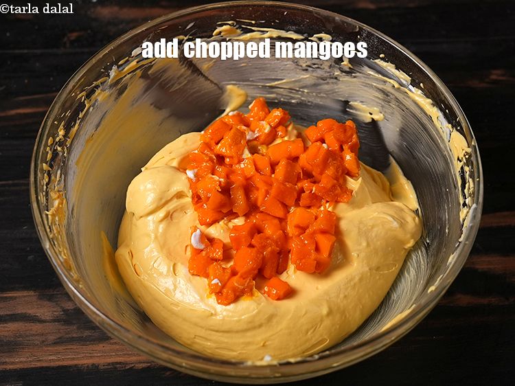 Step 24 – Add &frac14; cup <a href="https://www.tarladalal.com/glossary-chopped-mango-803i">chopped mangoes</a>.