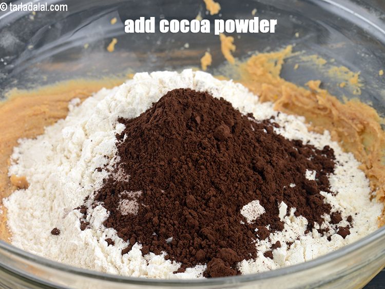 Step 23 – Add 2 tbsp <a href="https://www.tarladalal.com/glossary-cocoa-powder-284i">cocoa powder</a>.