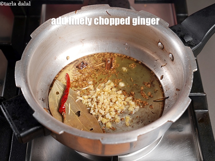 Step 23 – Add &frac12; tbsp finely <a href="https://www.tarladalal.com/glossary-chopped-ginger-786i">chopped ginger (adrak)</a>.