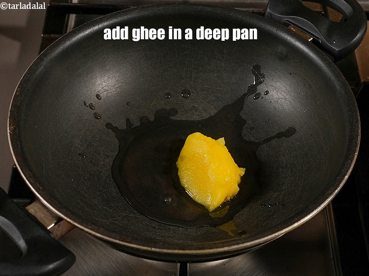 Step 23 – Add 1 tbsp <a href="https://www.tarladalal.com/glossary-ghee-245i">ghee</a> in a deep pan.