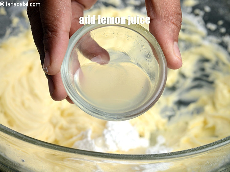 Step 25 – Add &frac12; tbsp <a href="https://www.tarladalal.com/glossary-lemon-juice-numbi-ka-ras-nimbu-ka-juice-471i">lemon juice</a> in the butter cream cheese mixture.