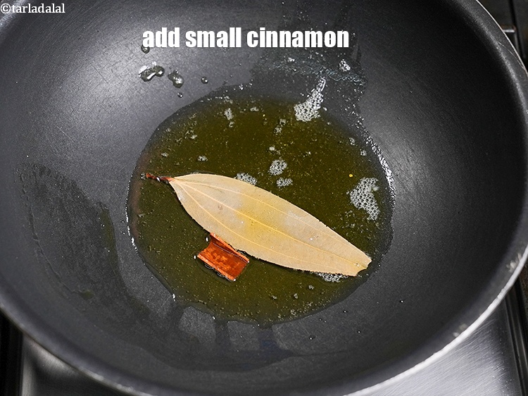 Step 23 – Add 1 small <a href="https://www.tarladalal.com/glossary-cinnamon-dalchini-346i">cinnamon (dalchini)</a>.