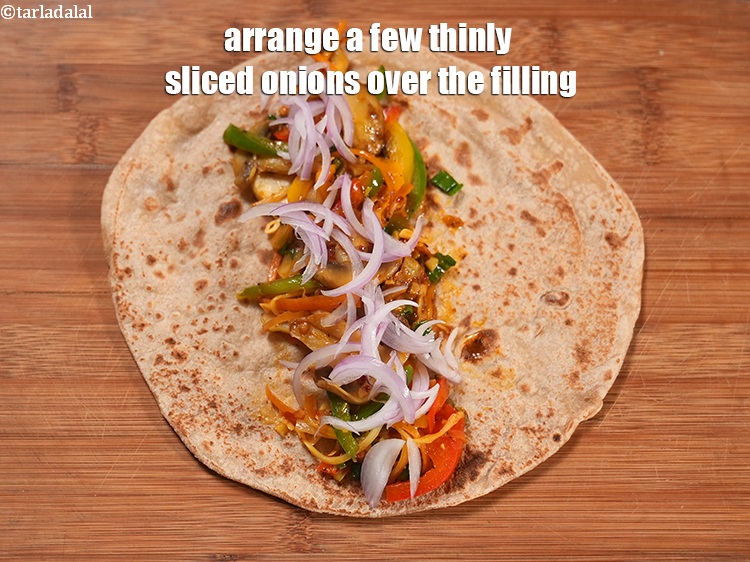 Step 23 – Arrange a few thinly sliced onions over the filling.