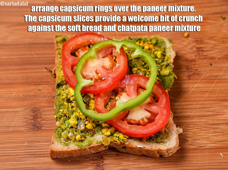 Step 23 – Arrange 1 <a href="https://www.tarladalal.com/glossary-capsicum-rings-167i">capsicum rings</a> over the paneer mixture. The capsicum slices provide a welcome …