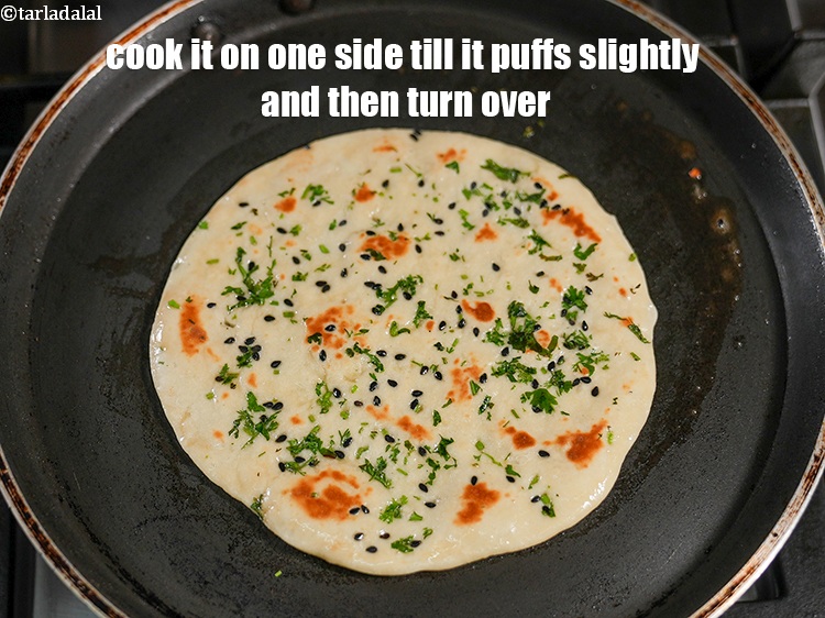 Step 23 – Cook it on one side till it puffs slightly and then turn over.