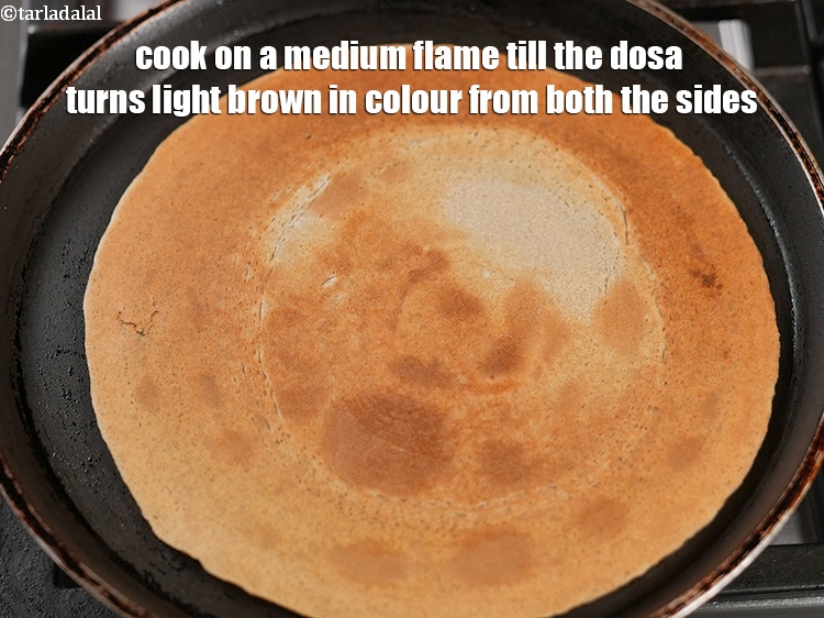 Step 23 – Cook on a medium flame till the dosa turns light brown in colour from both …