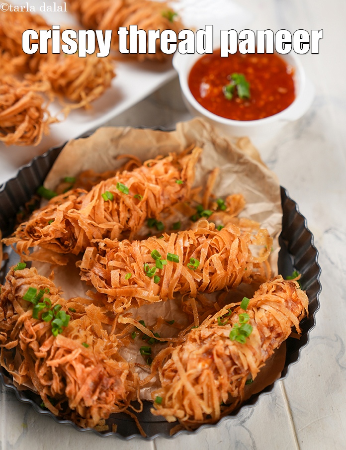 Step 23 – Serve <strong>threaded paneer</strong> hot with sweet chili garlic sauce.