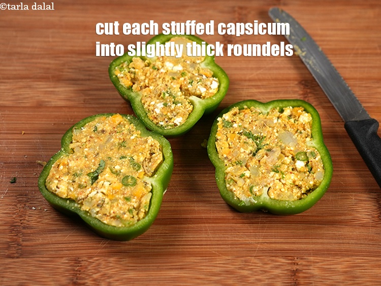 Step 23 – Now thickly slice each stuffed capsicum into slightly thick roundels.