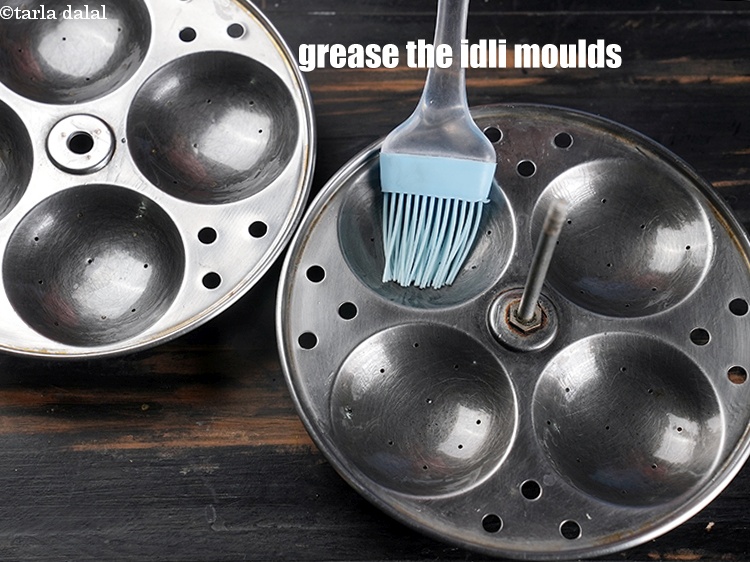 Step 28 – Grease the idli moulds using little oil.