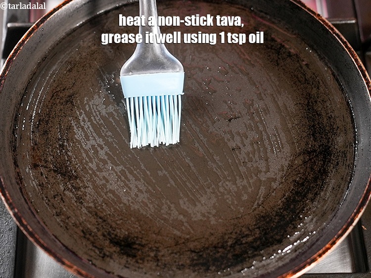 Step 23 – Heat a non-stick tava (griddle), grease it well using 1 tsp oil.