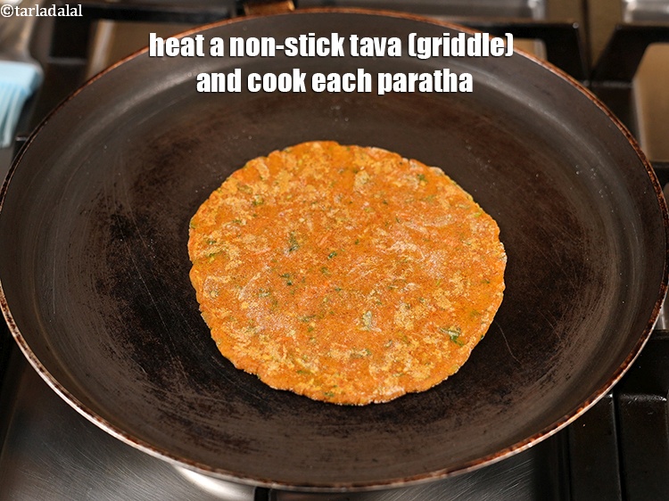 Step 22 – Heat a non-stick tava (griddle) and cook each paratha.