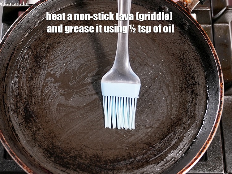 Step 24 – Heat a non-stick tava (griddle) and grease it using &frac12; tsp of oil.