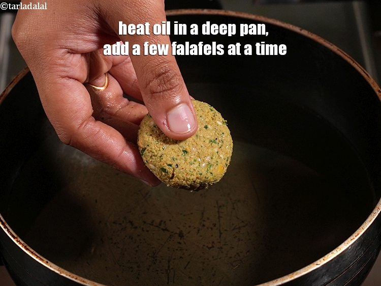 Step 23 – Heat oil in a deep pan, add a few falafels at a time.