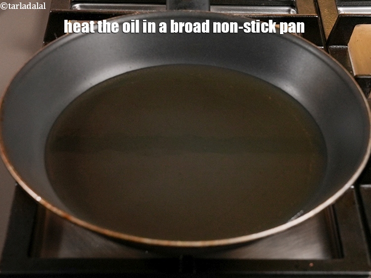 Step 23 – Heat the oil in a broad non-stick pan.