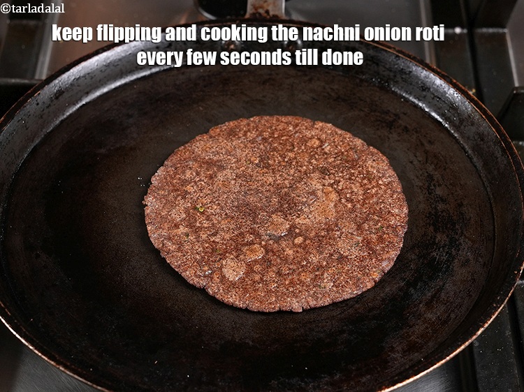 Step 25 – Keep flipping and cooking the <strong>nachni onion roti | ragi masala roti | healthy&nbsp;nachni onion …
