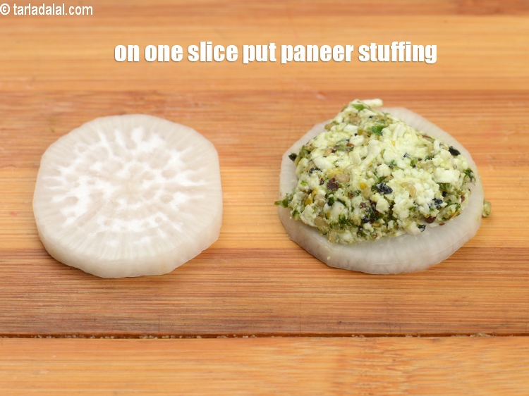 Step 24 – On one slice put approx. 1 tsp of the paneer stuffing and spread.&nbsp;
