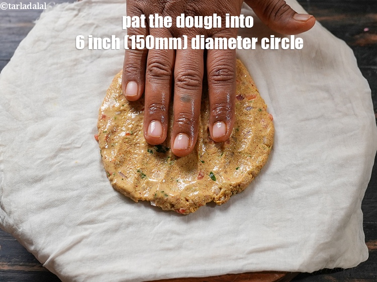 Step 24 – Pat the dough using wet fingers into 6 inch (150mm) diameter circle.