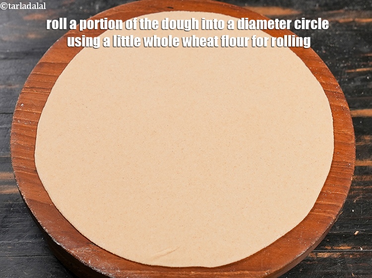 Step 23 – Roll a portion of the dough into a 225 mm. (9 inch) diameter circle using …