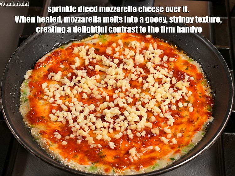 Step 23 – Sprinkle &frac14; cup <a href="https://www.tarladalal.com/glossary-diced-mozzarella-cheese-2805i">diced mozzarella cheese</a> over it. When heated, mozzarella melts into a …