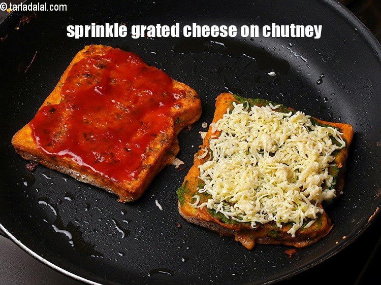 Step 24 – Sprinkle 1&frac12; tbsp <a href="https://www.tarladalal.com/glossary-grated-processed-cheese-868i">grated processed cheese</a> on chutney besan toast.
