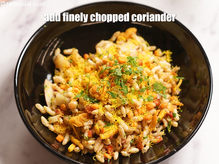 Step 24 – Add finely <a href="https://www.tarladalal.com/glossary-chopped-coriander-783i">chopped coriander (dhania)</a>.