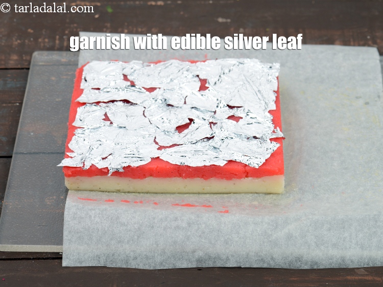 Step 23 – Garnish with <a href="https://www.tarladalal.com/glossary-edible-silver-leaf-613i">edible silver leaf (vark)</a>.
