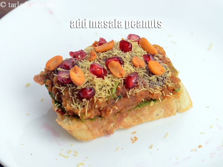 Step 22 – Add 1 tsp <a href="https://www.tarladalal.com/glossary-masala-peanuts-masala-sing-spicy-peanuts-1188i">masala peanuts</a>.