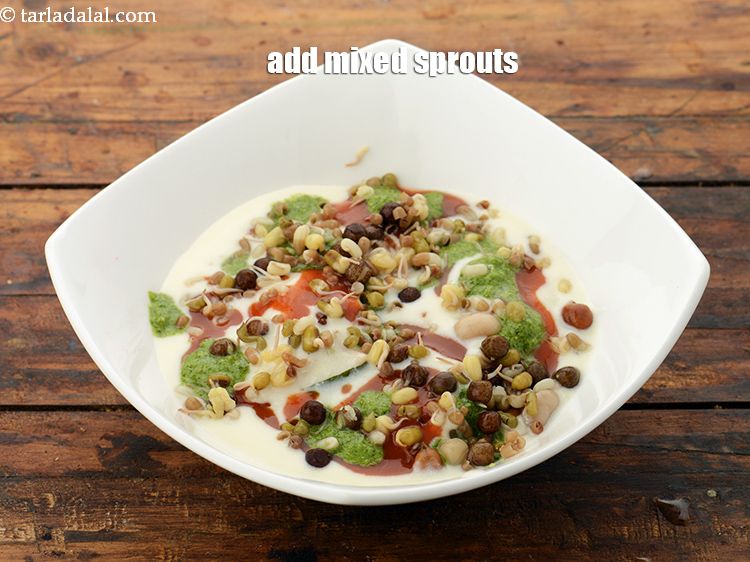 Step 55 – Put 2 tbsp <a href="https://www.tarladalal.com/glossary-mixed-sprouts-195i#ing_1663" target="_blank">mixed sprouts</a> evenly over it.