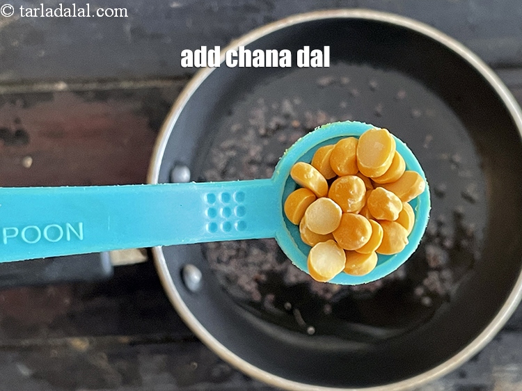 Step 23 – Add&nbsp;<meta charset="UTF-8" />1/2 tsp&nbsp;<a href="glossary-chana-dal-split-bengal-gram-285i">chana dal (split bengal gram)</a>.