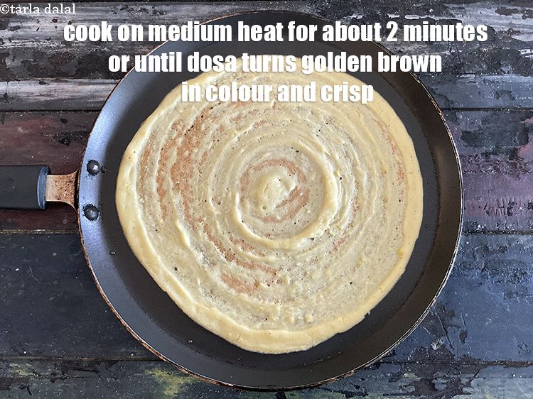 Step 28 – Cook on a medium flame for about 2 minutes till the dosa turns golden brown …