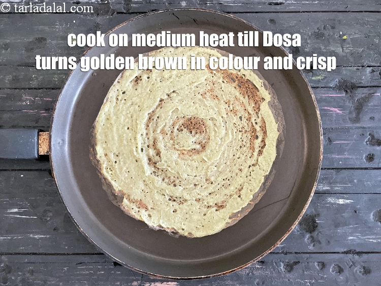Step 27 – Cook on a medium flame till the dosa turns golden brown in colour and crisp.