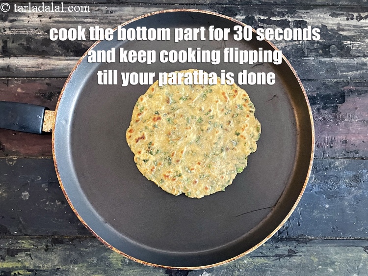 Step 24 – <meta charset="UTF-8" /> Cook the bottom part of the roti for 30 seconds and keep …
