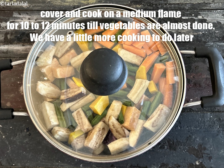 Step 23 – Cover and cook on a <strong>medium flame</strong>&nbsp;for &nbsp;10&nbsp;to 12&nbsp;minutes till vegetables are almost done. We …