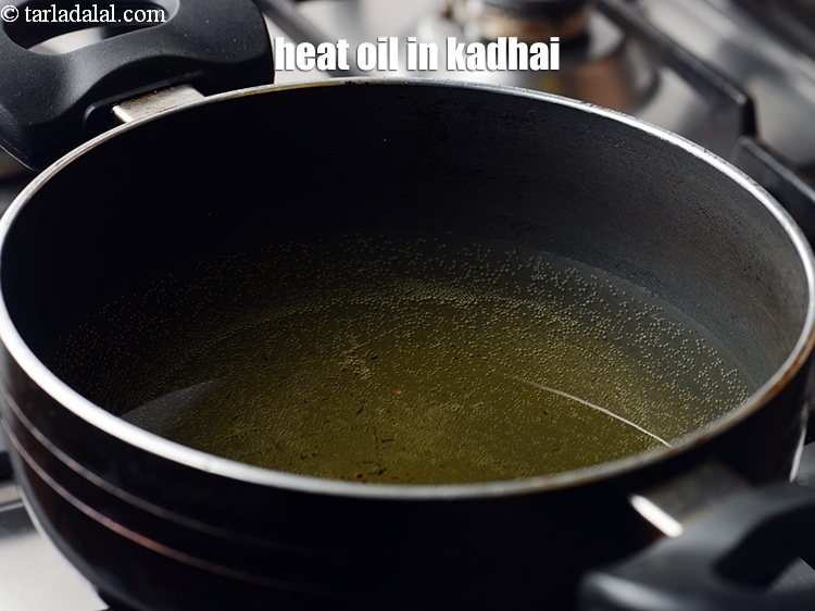 Step 24 – Heat the oil in a kadhai.