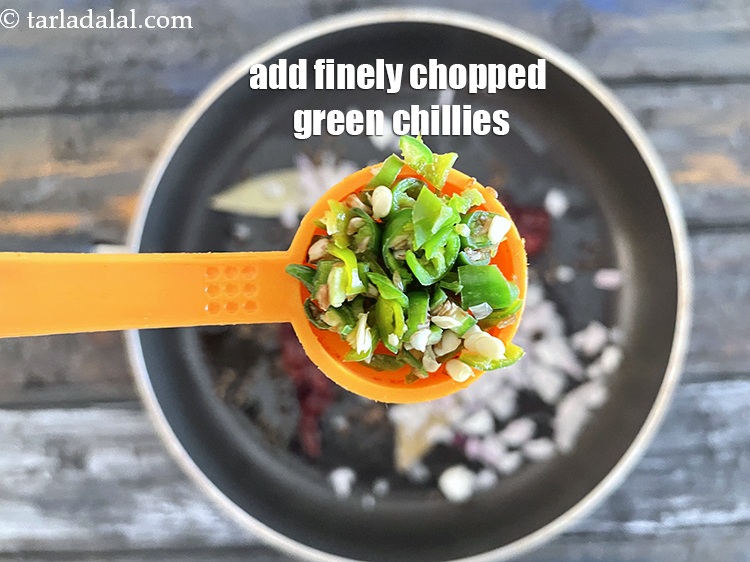 Step 23 – Add&nbsp;<meta charset="UTF-8" />2 tsp&nbsp;finely&nbsp;<a href="glossary-chopped-green-chilli-820i">chopped green chillies</a>.