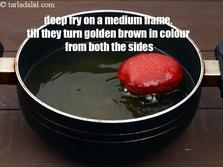 Step 22 – Deep fry on a medium flame, till they turn golden brown in colour from both …