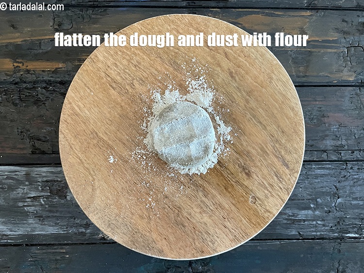 Step 24 – <meta charset="UTF-8" /> Flatten the dough and dust with whole wheat flour.