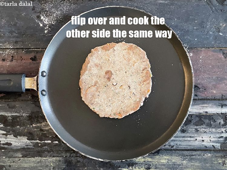 Step 23 – <meta charset="UTF-8" />Flip over and cook the roti on the other side the same way.&nbsp;