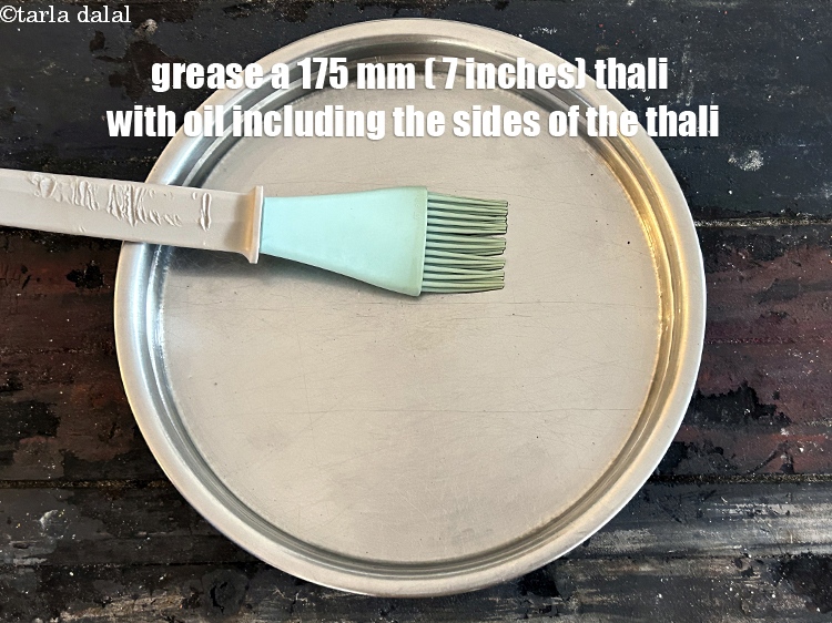 Step 23 – Grease a 175 mm (7 inch) thali with a little oil including the sides of …