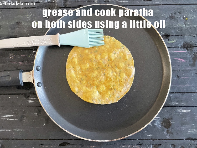 Step 23 – <meta charset="UTF-8" /> Grease and cook&nbsp;<strong>masala paratha</strong>&nbsp;using little oil till golden brown spots appear on …
