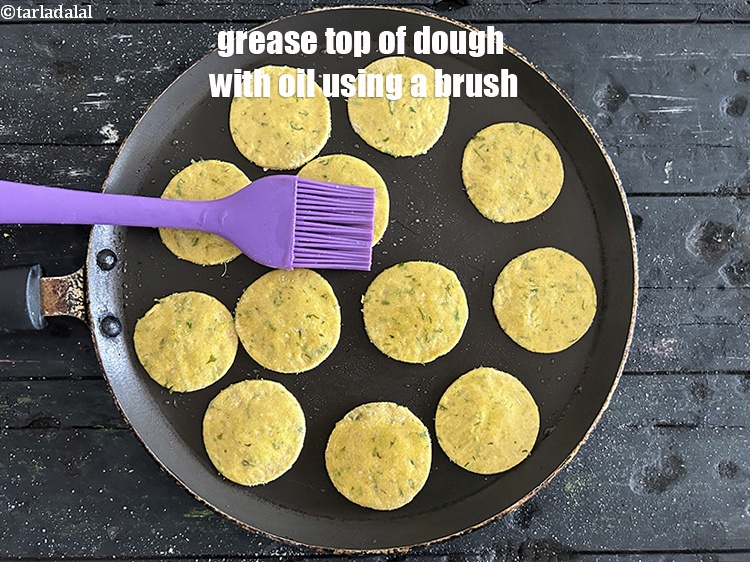 Step 32 – Grease top of&nbsp;dough circles with oil using a brush.