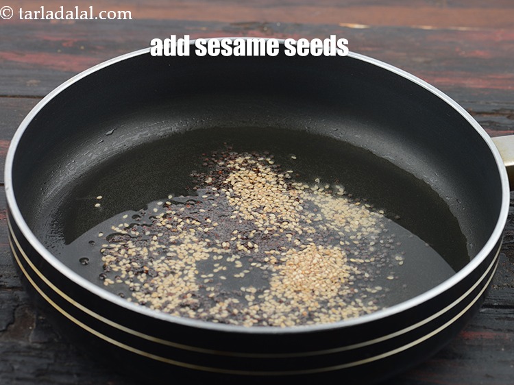 Step 23 – Add 2 tbsp&nbsp;<a href="https://www.tarladalal.com/glossary-sesame-seeds-til-gingelly-seeds-612i">sesame seeds (til)</a>.&nbsp;